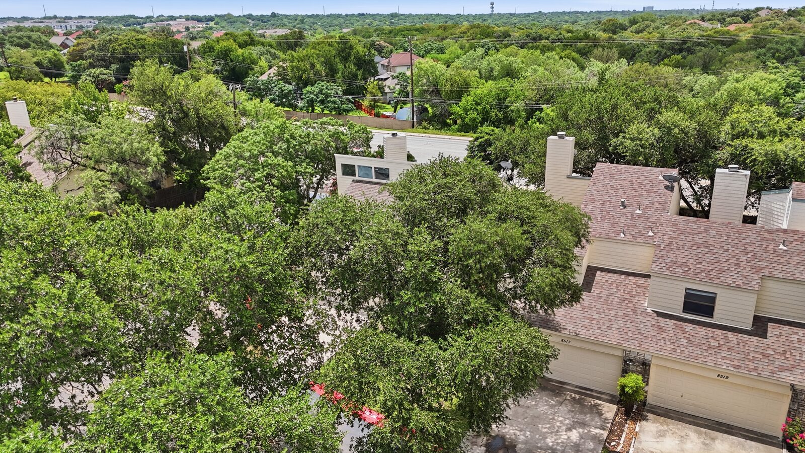 Aerial view showing neighboring townhomes within the Echo Creek community