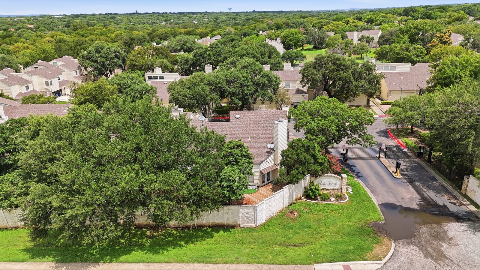 Aerial view of the Echo Creek community sign and gated entrance